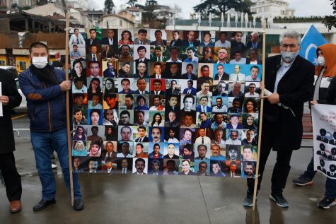 Members in the Uighur community during a protest displayed pictures of family and friends who they fear may be in the camps.